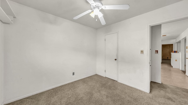 212 E Rentz St, Weatherford, TX 76086 - unfurnished bedroom with light carpet, baseboards, and ceiling fan
