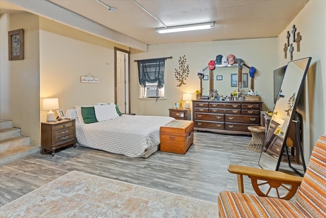 1320 Laredo Dr, Granbury, TX 76048 - bedroom featuring wood finished floors and cooling unit