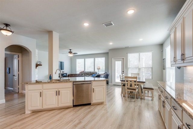1421 Cedar Creek Dr, Anna, TX 75409 - kitchen featuring stainless steel dishwasher, a sink, open floor plan, light wood finished floors, and a ceiling fan