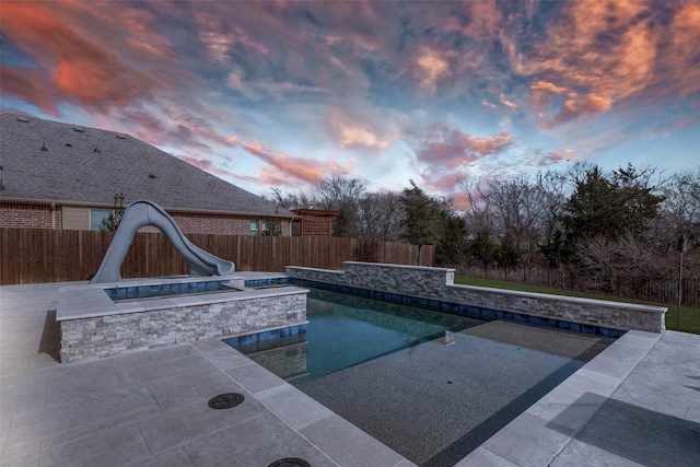 1421 Cedar Creek Dr, Anna, TX 75409 - pool at dusk featuring a water slide, a patio, and a fenced backyard