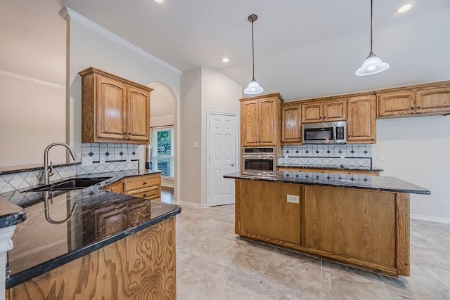 230 Mitchell Blvd, Weatherford, TX 76087 - kitchen featuring appliances with stainless steel finishes, a sink, dark stone countertops, baseboards, and crown molding
