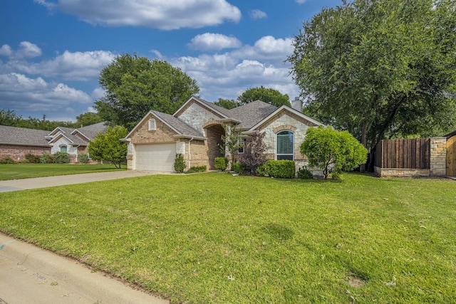 230 Mitchell Blvd, Weatherford, TX 76087 - view of front facade with a chimney, driveway, stone siding, a garage, and brick siding