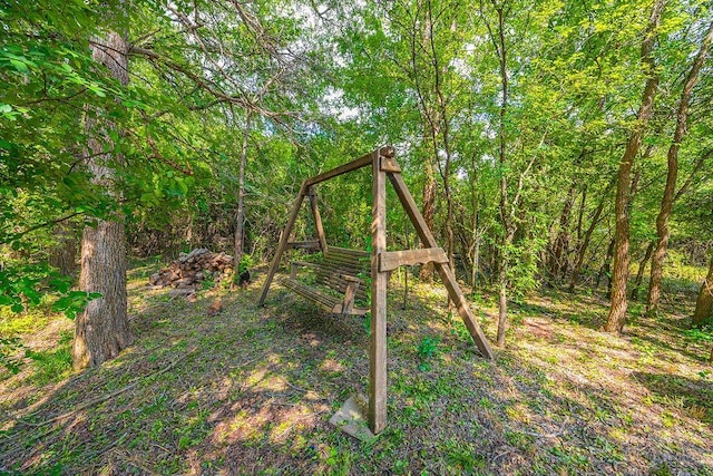 230 Mitchell Blvd, Weatherford, TX 76087 - view of yard featuring a wooded view