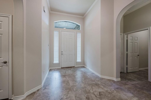 230 Mitchell Blvd, Weatherford, TX 76087 - entryway with arched walkways, crown molding, and baseboards