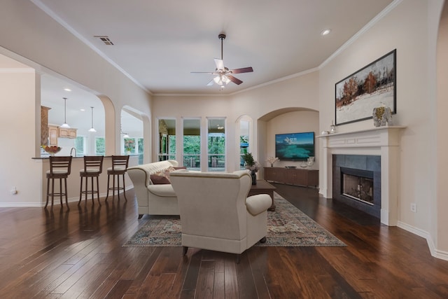 230 Mitchell Blvd, Weatherford, TX 76087 - living area with a ceiling fan, wood-type flooring, a tiled fireplace, ornamental molding, and recessed lighting