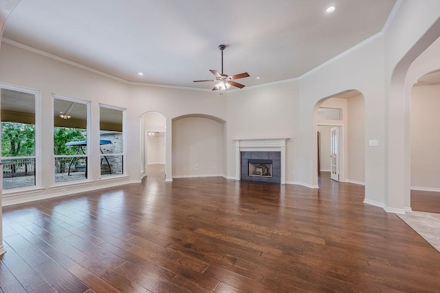 230 Mitchell Blvd, Weatherford, TX 76087 - unfurnished living room featuring ceiling fan, crown molding, hardwood / wood-style floors, recessed lighting, and a tiled fireplace