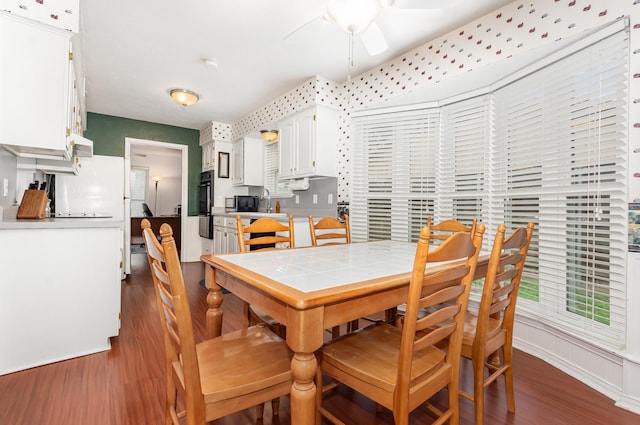 1621 Villanova Dr, Richardson, TX 75081 - dining area featuring dark wood finished floors and a ceiling fan