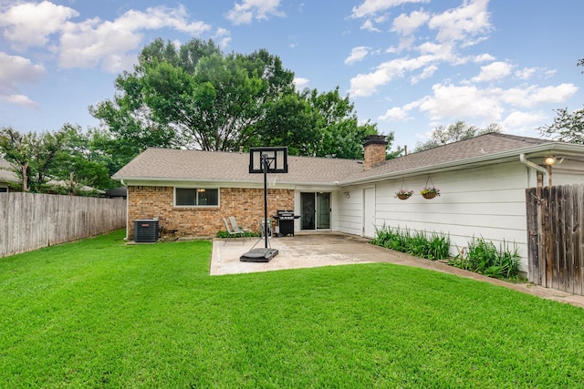 1621 Villanova Dr, Richardson, TX 75081 - back of house with central AC unit, a patio area, a chimney, and a shingled roof