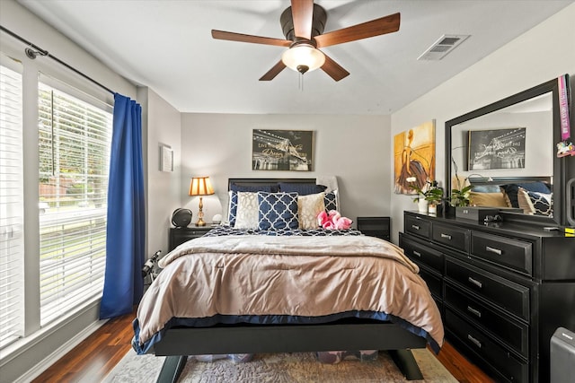 3701 Knob Hill Dr, Plano, TX 75023 - bedroom with dark wood-style flooring and a ceiling fan