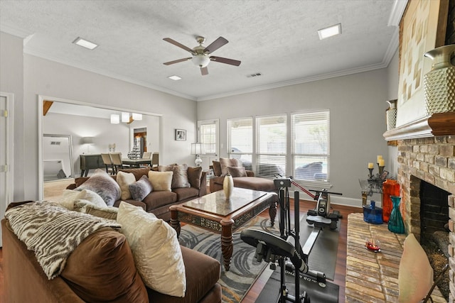 3701 Knob Hill Dr, Plano, TX 75023 - living area with ceiling fan, wood finished floors, a fireplace with raised hearth, crown molding, and a textured ceiling