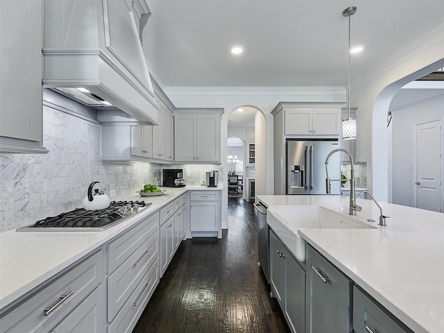 1551 Sweetwater Ln, Prosper, TX 75078 - kitchen featuring arched walkways, custom range hood, gray cabinets, crown molding, and recessed lighting