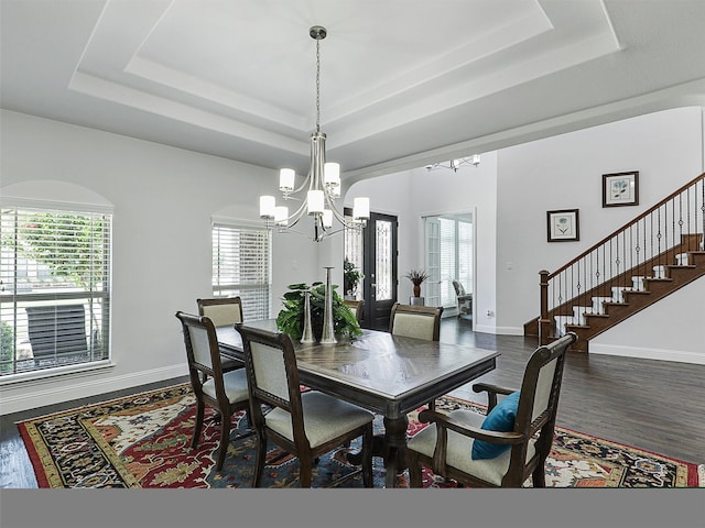 1551 Sweetwater Ln, Prosper, TX 75078 - dining space featuring a raised ceiling, a chandelier, and healthy amount of natural light