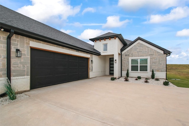 80 Dublin Cir, Gordonville, TX 76245 - view of front of house with concrete driveway, stone siding, an attached garage, roof with shingles, and brick siding