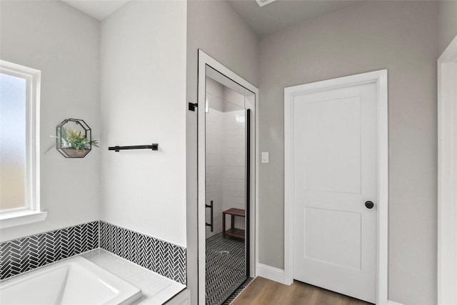 80 Dublin Cir, Gordonville, TX 76245 - bathroom with a shower stall, a garden tub, and wood finished floors