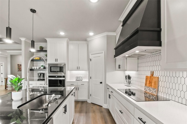 80 Dublin Cir, Gordonville, TX 76245 - kitchen featuring stainless steel appliances, custom range hood, backsplash, ornamental molding, and hanging light fixtures