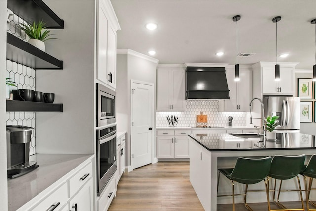 80 Dublin Cir, Gordonville, TX 76245 - kitchen with extractor fan, stainless steel appliances, backsplash, white cabinetry, and open shelves