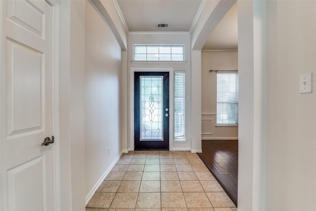 7806 Albany Dr, Rowlett, TX 75089 - foyer with arched walkways, crown molding, and plenty of natural light