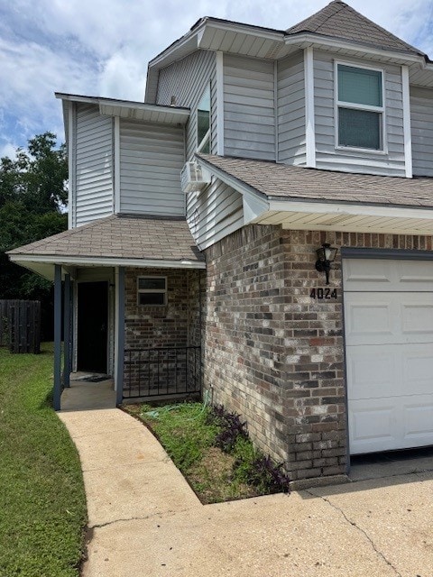 4024 Southern Charm Ct, Arlington, TX 76016 - view of front facade with an attached garage, brick siding, and roof with shingles