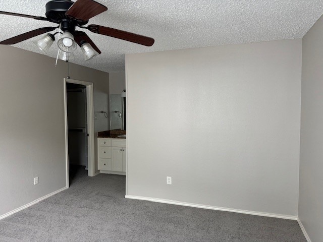 4024 Southern Charm Ct, Arlington, TX 76016 - unfurnished bedroom featuring light colored carpet, a textured ceiling, baseboards, ensuite bathroom, and ceiling fan