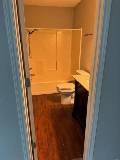 4024 Southern Charm Ct, Arlington, TX 76016 - full bathroom featuring vanity, toilet, wood finished floors, and shower / bath combination