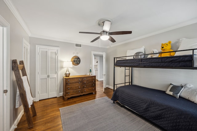 6443 Velasco Ave, Dallas, TX 75214 - bedroom featuring dark wood-style flooring, crown molding, baseboards, a closet, and a ceiling fan
