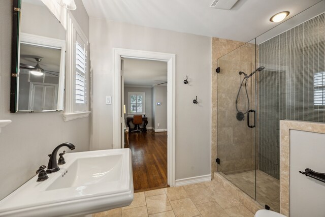 6443 Velasco Ave, Dallas, TX 75214 - full bath featuring a shower stall, ceiling fan, and baseboards