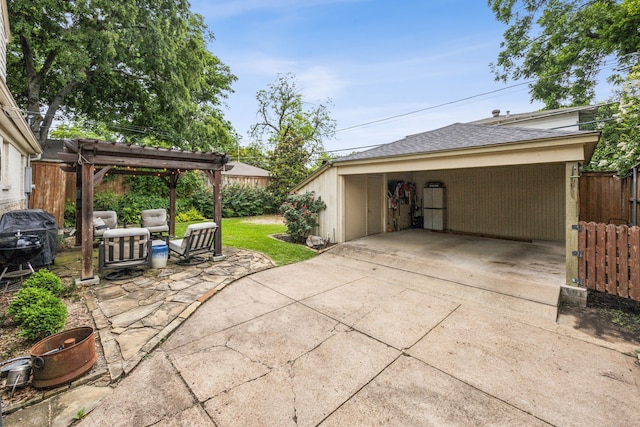 6443 Velasco Ave, Dallas, TX 75214 - view of patio / terrace with a pergola and a garage