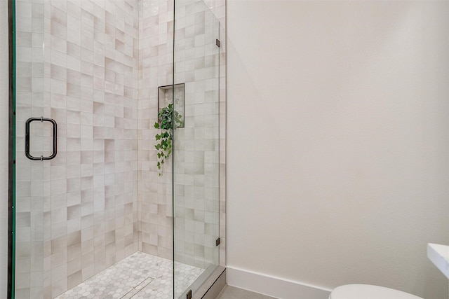 4513 Fair Creek Ter, Fort Worth, TX 76008 - full bath featuring a stall shower, toilet, and baseboards