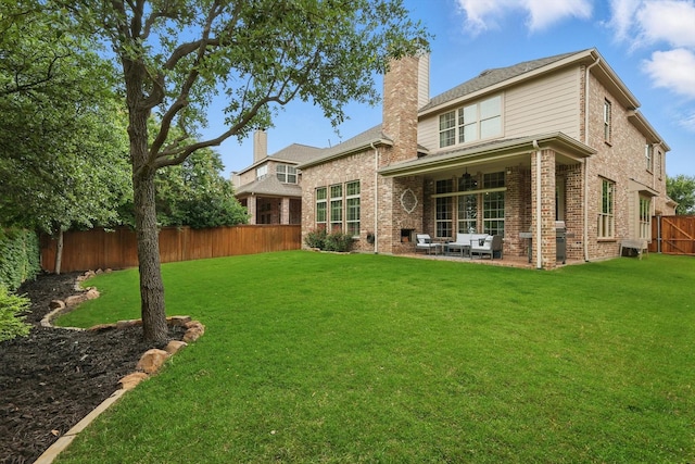 9008 Cypress Creek Rd, Lantana, TX 76226 - rear view of house with a patio area, a chimney, and brick siding