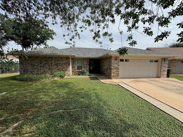 1402 Clarks Dr, Abilene, TX 79602 - single story home featuring a garage, driveway, a front yard, and brick siding