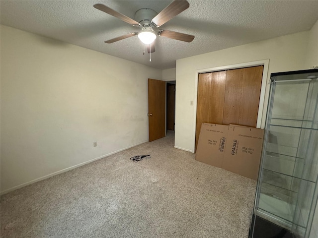 1402 Clarks Dr, Abilene, TX 79602 - unfurnished bedroom with carpet flooring, a textured ceiling, a closet, ceiling fan, and baseboards