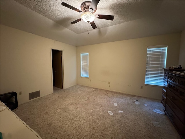 1402 Clarks Dr, Abilene, TX 79602 - unfurnished bedroom with carpet, lofted ceiling, a ceiling fan, and a textured ceiling
