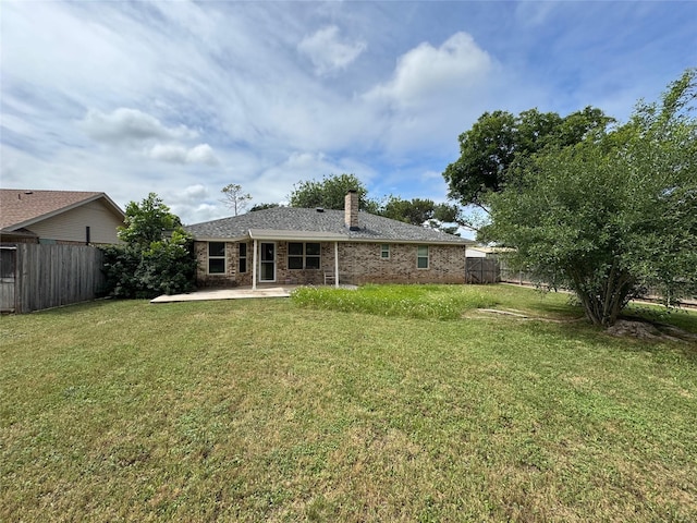 1402 Clarks Dr, Abilene, TX 79602 - rear view of house featuring a patio area, a chimney, and brick siding