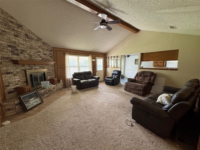 1402 Clarks Dr, Abilene, TX 79602 - living area with a ceiling fan, a textured ceiling, carpet floors, and a fireplace