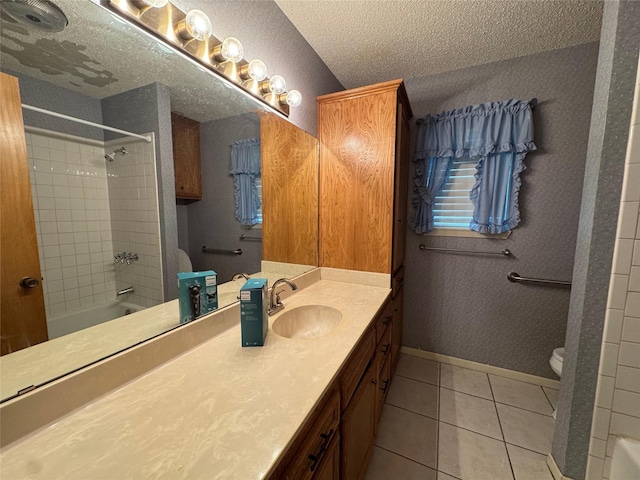 1402 Clarks Dr, Abilene, TX 79602 - full bathroom featuring toilet, a textured ceiling, vanity, tile patterned floors, and tub / shower combination