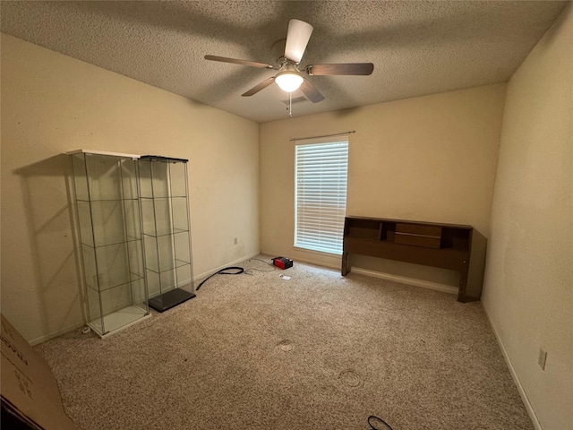 1402 Clarks Dr, Abilene, TX 79602 - spare room with ceiling fan, carpet flooring, a textured ceiling, and baseboards