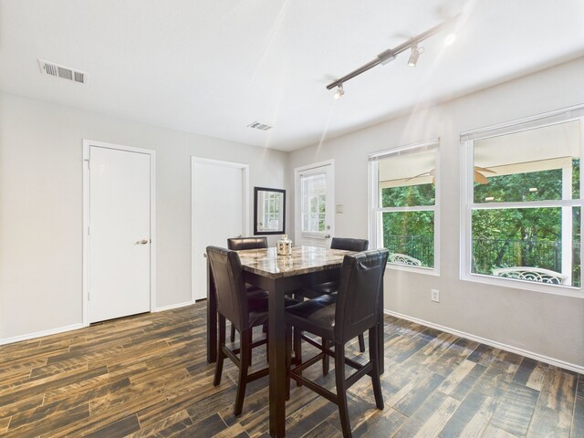 1308 Rambling Brook Trl, Denton, TX 76210 - kitchen with stainless steel appliances, a sink, white cabinetry, dark wood-style floors, and tasteful backsplash