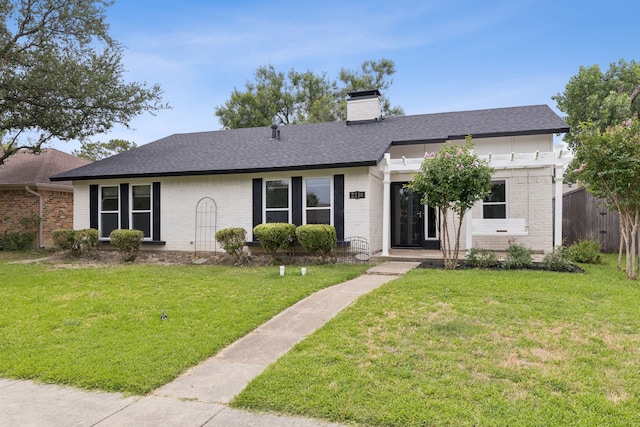 2218 Greenvalley Dr, Carrollton, TX 75007 - view of front of house with brick siding, a chimney, and roof with shingles