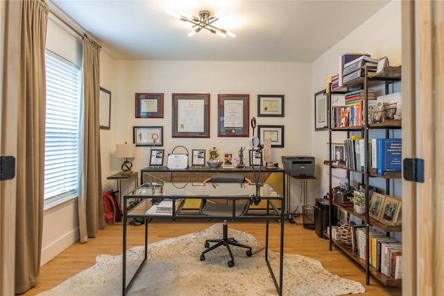 729 Bizerte Ave, Dallas, TX 75224 - home office featuring wood finished floors and baseboards