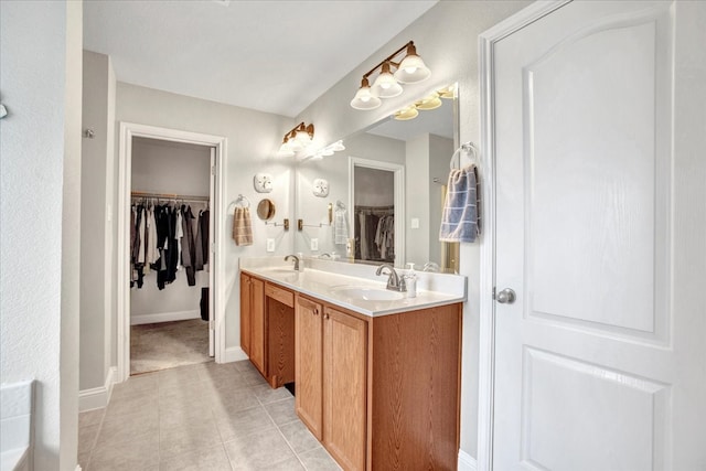 2400 Silver Maple Dr, Saint Paul, TX 75098 - full bathroom featuring a spacious closet, double vanity, baseboards, and tile patterned floors