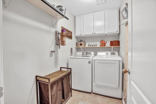 2400 Silver Maple Dr, Saint Paul, TX 75098 - laundry area with cabinet space, washing machine and clothes dryer, and light tile patterned flooring