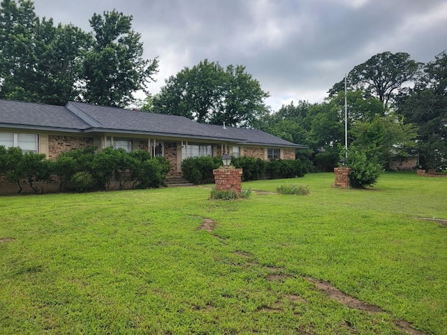 316 Charlie Dr, Whitesboro, TX 76273 - ranch-style house featuring a front yard and brick siding