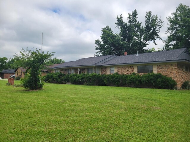 316 Charlie Dr, Whitesboro, TX 76273 - ranch-style house featuring a front yard and brick siding