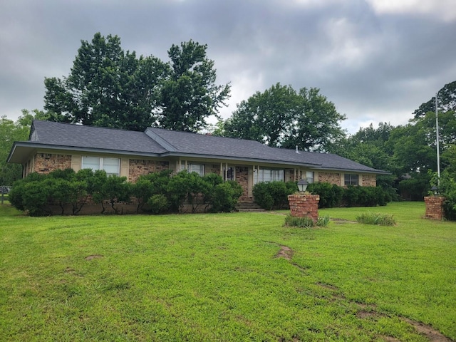 316 Charlie Dr, Whitesboro, TX 76273 - ranch-style house featuring a front lawn and brick siding