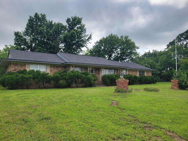 316 Charlie Dr, Whitesboro, TX 76273 - single story home featuring a front lawn and brick siding
