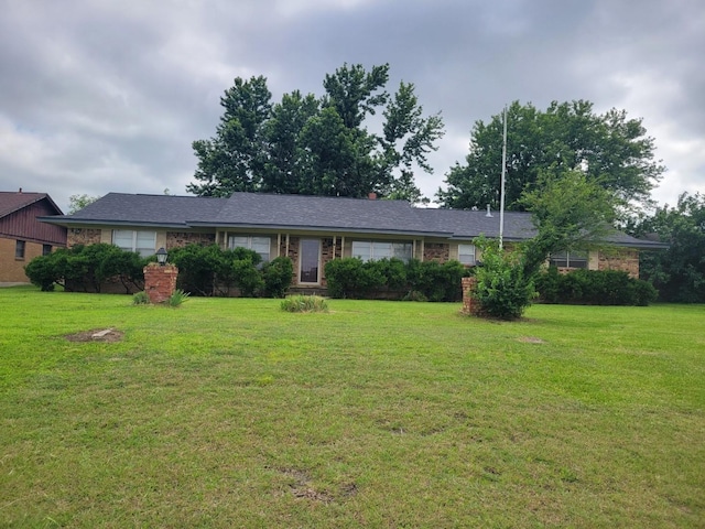 316 Charlie Dr, Whitesboro, TX 76273 - single story home with a front yard and brick siding