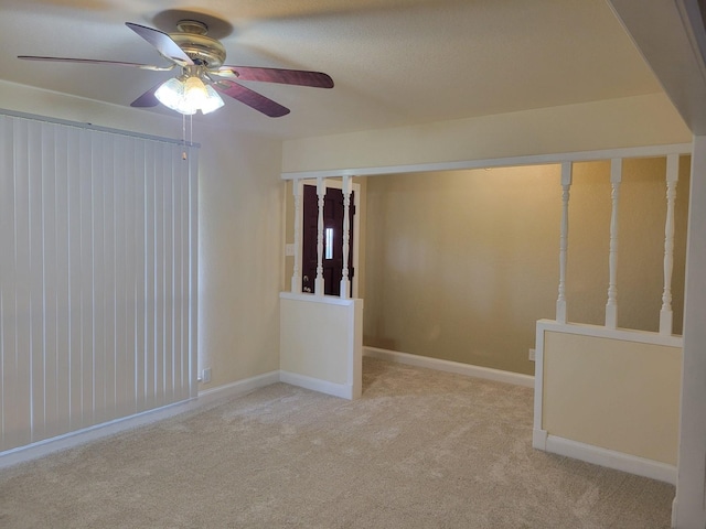 316 Charlie Dr, Whitesboro, TX 76273 - unfurnished room with ceiling fan, light carpet, and baseboards