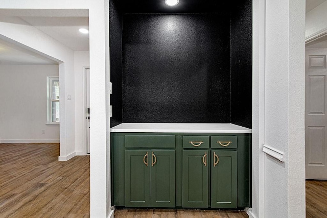 715 Pheasant Run, Burleson, TX 76028 - detailed view of wood finished floors and baseboards