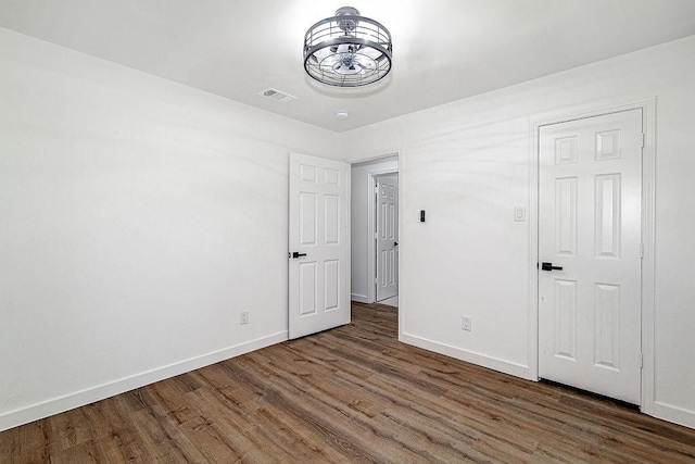 715 Pheasant Run, Burleson, TX 76028 - unfurnished bedroom with baseboards and wood finished floors