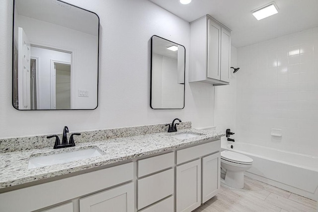 715 Pheasant Run, Burleson, TX 76028 - full bathroom featuring toilet, double vanity, and bathtub / shower combination